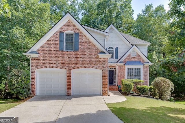 1614 Summersweet Ln, Dacula, GA 30019 - traditional-style home with concrete driveway, brick siding, and a front yard