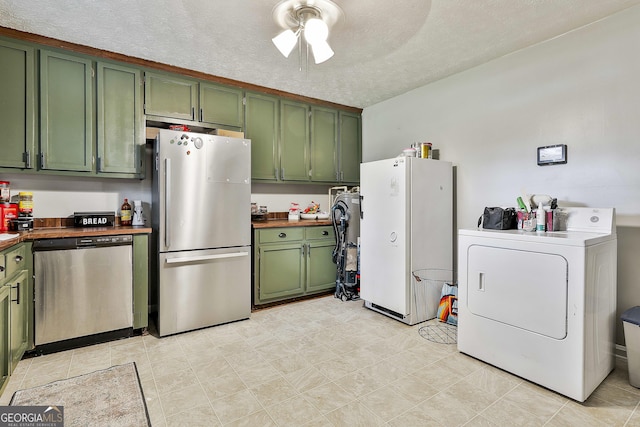 3453 Hogansville Rd, Lagrange, GA 30241 - kitchen featuring green cabinetry, appliances with stainless steel finishes, washer / clothes dryer, ceiling fan, and a textured ceiling