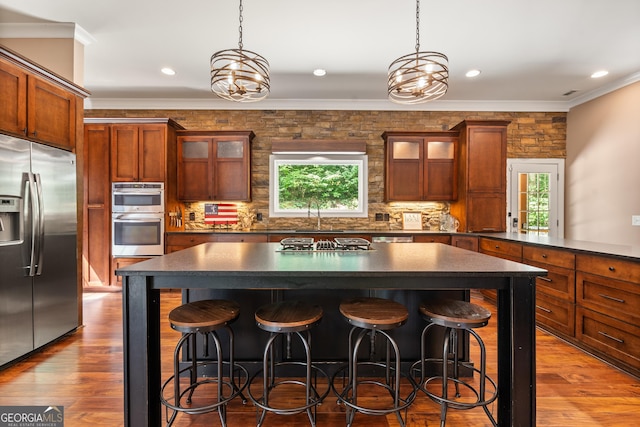 112 Springhill Ln, Clarkesville, GA 30523 - kitchen with appliances with stainless steel finishes, dark countertops, healthy amount of natural light, crown molding, and recessed lighting