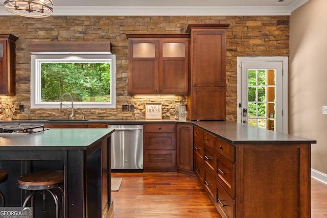 112 Springhill Ln, Clarkesville, GA 30523 - kitchen with stainless steel dishwasher, ornamental molding, dark countertops, decorative backsplash, and a peninsula