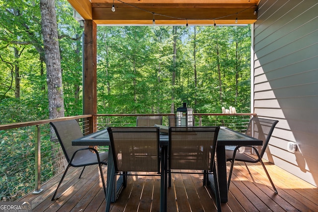 112 Springhill Ln, Clarkesville, GA 30523 - wooden terrace featuring outdoor dining area and a view of trees