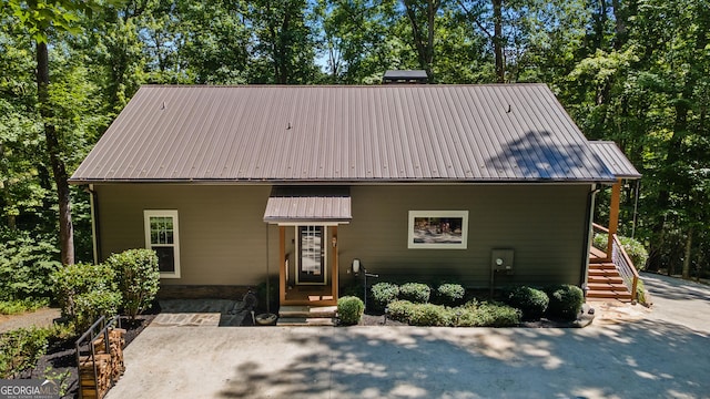 112 Springhill Ln, Clarkesville, GA 30523 - view of front of property with a metal roof, a patio, and view of scattered trees