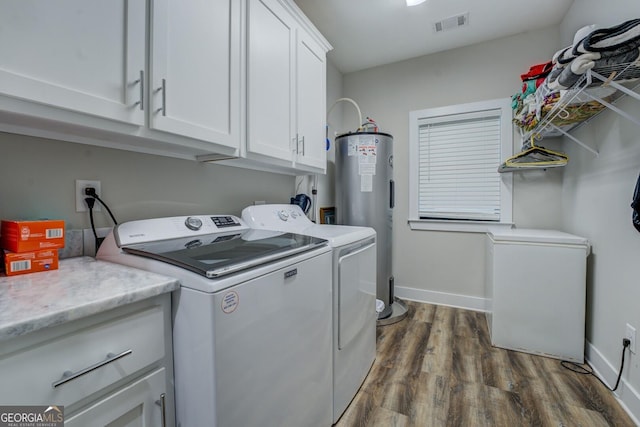 2591 Reids Ferry Rd, Buckhead, GA 30625 - laundry room featuring washer and clothes dryer, water heater, dark wood finished floors, and cabinet space