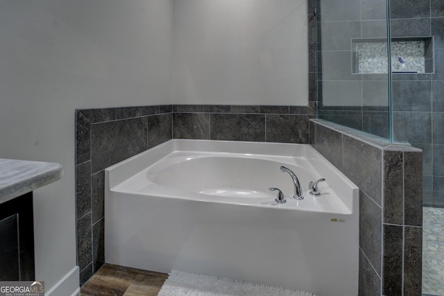 2591 Reids Ferry Rd, Buckhead, GA 30625 - bathroom featuring a garden tub and wood finished floors