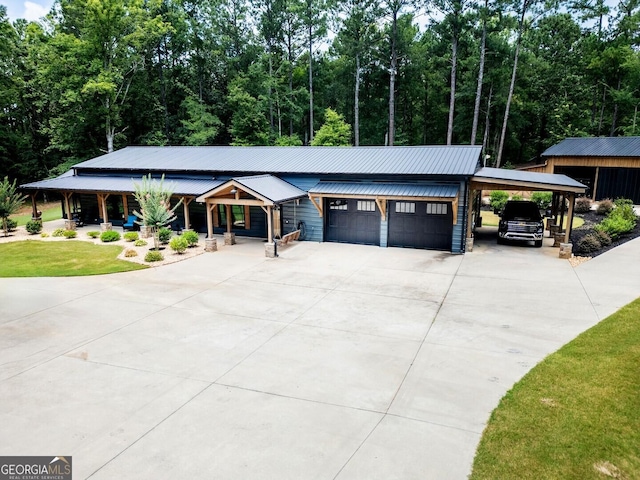 2591 Reids Ferry Rd, Buckhead, GA 30625 - view of front facade with a garage, a porch, concrete driveway, a front yard, and a metal roof