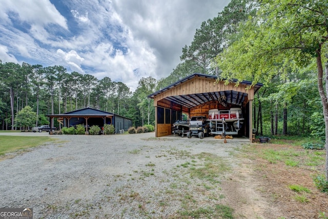 2591 Reids Ferry Rd, Buckhead, GA 30625 - view of car parking featuring a pole building, a detached carport, and driveway