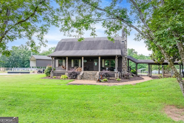 335 Jones Rd, Jefferson, GA 30549 - view of front facade featuring covered porch, a front yard, and a shingled roof