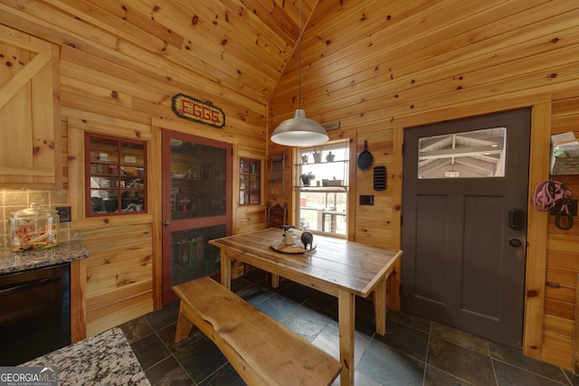 335 Jones Rd, Jefferson, GA 30549 - dining space with stone tile floors and wooden walls