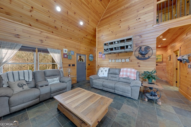 335 Jones Rd, Jefferson, GA 30549 - living area with stone tile flooring, wood walls, a high ceiling, and recessed lighting