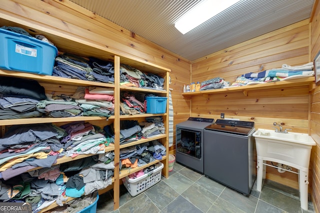335 Jones Rd, Jefferson, GA 30549 - washroom with washing machine and clothes dryer and wood walls