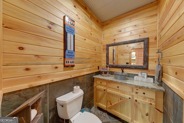 335 Jones Rd, Jefferson, GA 30549 - half bathroom with vanity and wooden walls