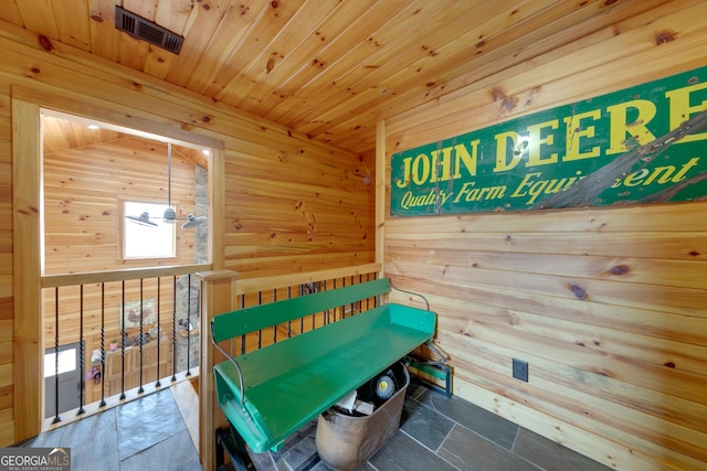 335 Jones Rd, Jefferson, GA 30549 - sitting room featuring wooden walls, wood ceiling, and stone finish flooring