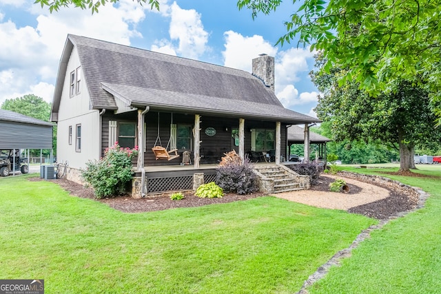 335 Jones Rd, Jefferson, GA 30549 - view of front of house featuring covered porch, a front lawn, a chimney, and a shingled roof