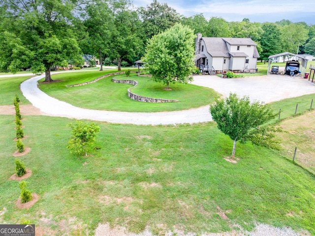 335 Jones Rd, Jefferson, GA 30549 - view of grassy yard featuring a carport and driveway