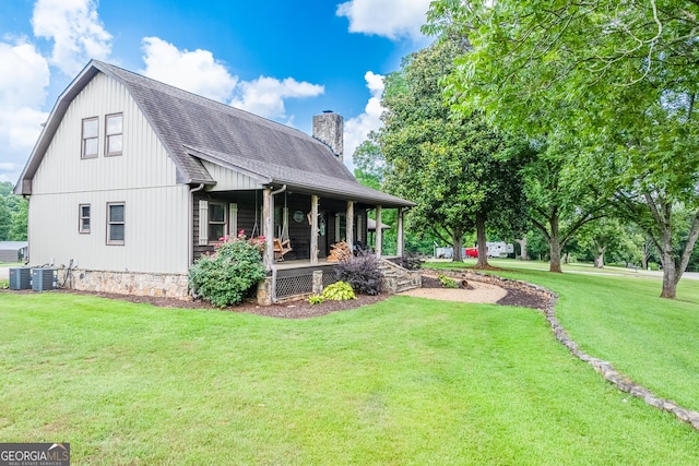 335 Jones Rd, Jefferson, GA 30549 - view of property exterior with covered porch, a chimney, a yard, and a shingled roof