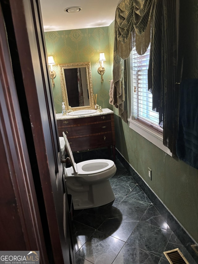 320 E 3rd Ave, Rome, GA 30161 - half bathroom with wallpapered walls, vanity, and marble finish floors