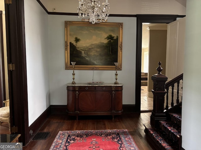 320 E 3rd Ave, Rome, GA 30161 - corridor featuring dark wood finished floors, a chandelier, and stairs