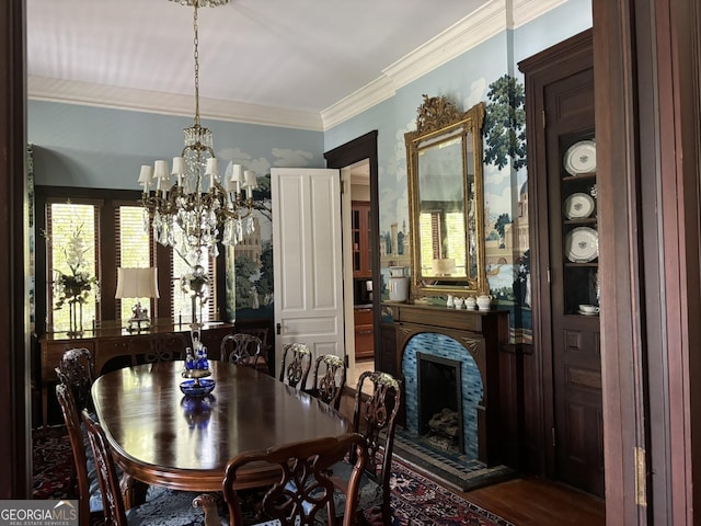 320 E 3rd Ave, Rome, GA 30161 - dining room with a chandelier, crown molding, a fireplace with raised hearth, and wood finished floors