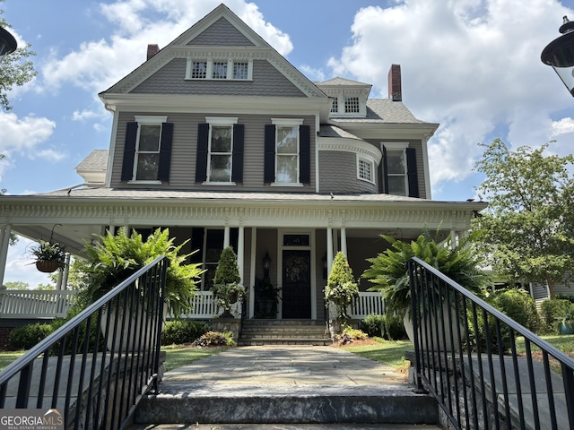 320 E 3rd Ave, Rome, GA 30161 - view of front of home with covered porch and a chimney