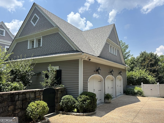 320 E 3rd Ave, Rome, GA 30161 - view of home's exterior with a gate, roof with shingles, concrete driveway, and a garage