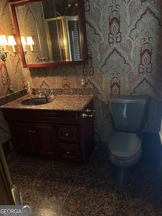 320 E 3rd Ave, Rome, GA 30161 - bathroom featuring wallpapered walls and vanity