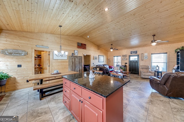 339 Jones Rd, Jefferson, GA 30549 - kitchen featuring wood ceiling, open floor plan, wooden walls, ceiling fan, and a kitchen island