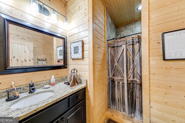 339 Jones Rd, Jefferson, GA 30549 - bathroom with wood walls, vanity, and a shower with curtain