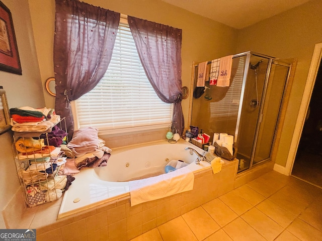 3545 SW Renaissance Cir, Atlanta, GA 30349 - bathroom with a shower stall, tile patterned flooring, and a tub with jets