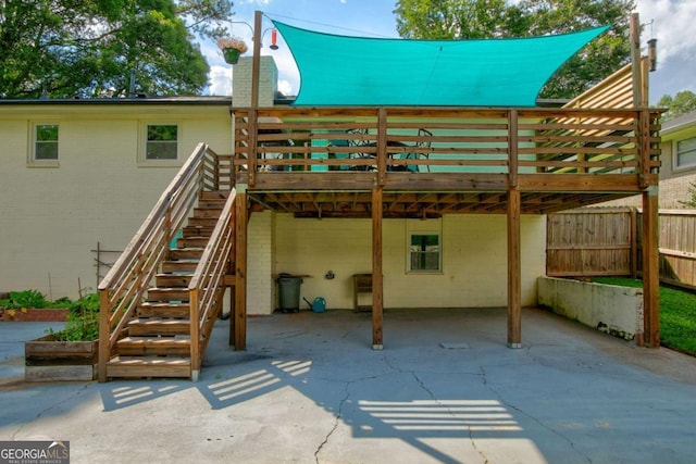 2200 Glendale Dr, Atlanta, GA 30032 - rear view of house with a wooden deck, a patio, a chimney, a carport, and stairs