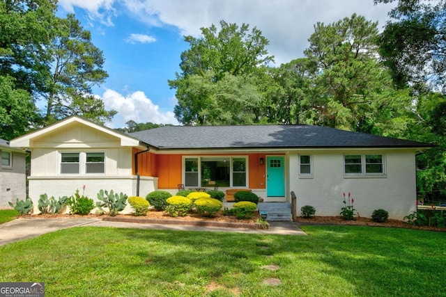 2200 Glendale Dr, Atlanta, GA 30032 - ranch-style house with brick siding, a front lawn, board and batten siding, and roof with shingles