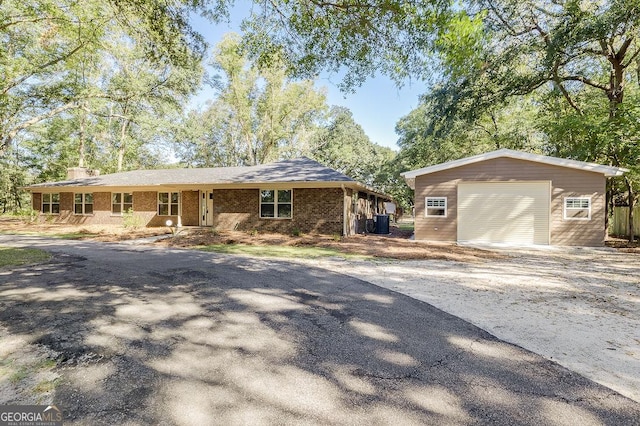 281 Noel C Conaway Rd, Guyton, GA 31312 - view of front of house featuring an outbuilding, a detached garage, and driveway
