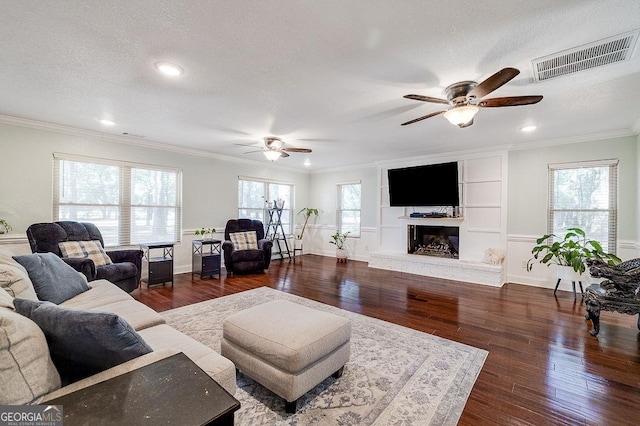 281 Noel C Conaway Rd, Guyton, GA 31312 - living room featuring a ceiling fan, dark wood-type flooring, plenty of natural light, recessed lighting, and ornamental molding