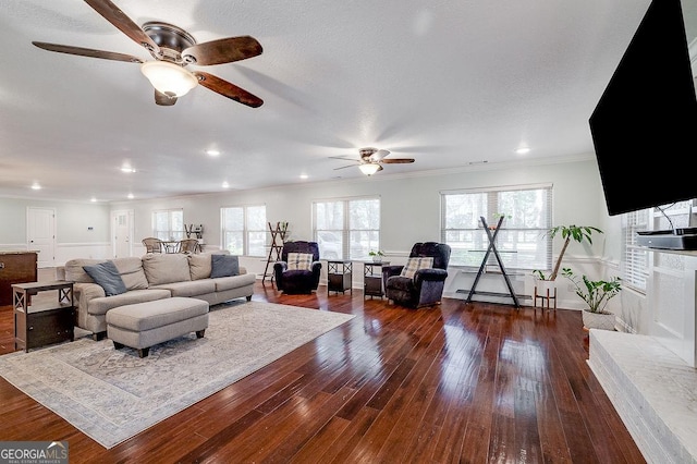 281 Noel C Conaway Rd, Guyton, GA 31312 - living room featuring a ceiling fan, ornamental molding, wood finished floors, plenty of natural light, and a baseboard heating unit