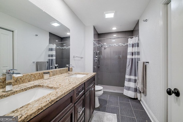 281 Noel C Conaway Rd, Guyton, GA 31312 - bathroom featuring a tile shower, double vanity, and tile patterned flooring