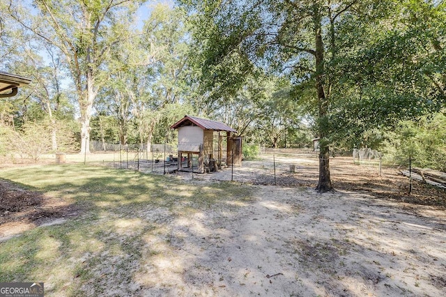 281 Noel C Conaway Rd, Guyton, GA 31312 - view of yard featuring exterior structure and an outbuilding