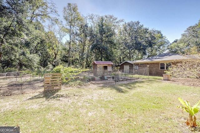 281 Noel C Conaway Rd, Guyton, GA 31312 - view of yard featuring a shed