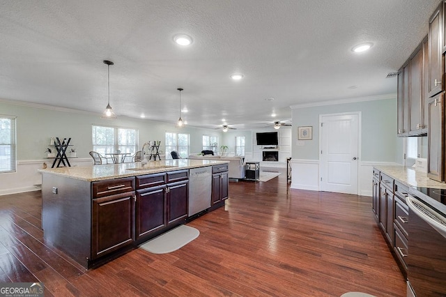 281 Noel C Conaway Rd, Guyton, GA 31312 - kitchen with dishwasher, range, open floor plan, ornamental molding, and dark wood finished floors