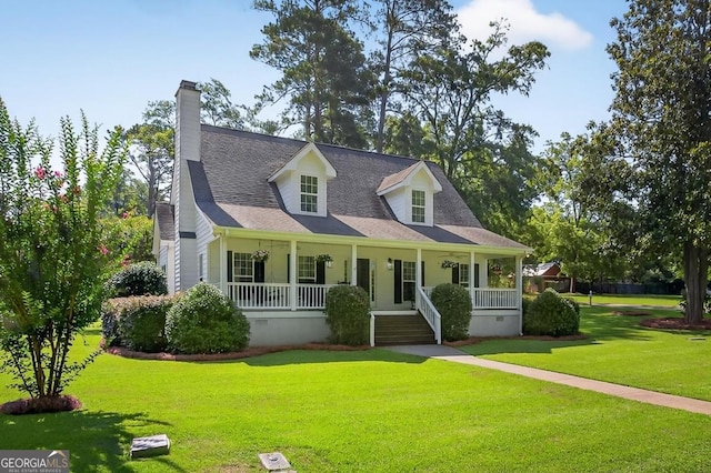 103 W Second St, Greensboro, GA 30642 - cape cod home with covered porch, a chimney, and a front lawn