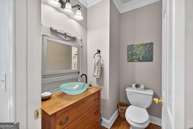 103 W Second St, Greensboro, GA 30642 - bathroom featuring crown molding, vanity, and wood finished floors
