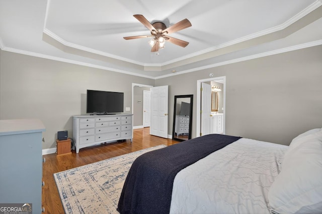 103 W Second St, Greensboro, GA 30642 - bedroom featuring a raised ceiling, wood finished floors, ceiling fan, and ornamental molding