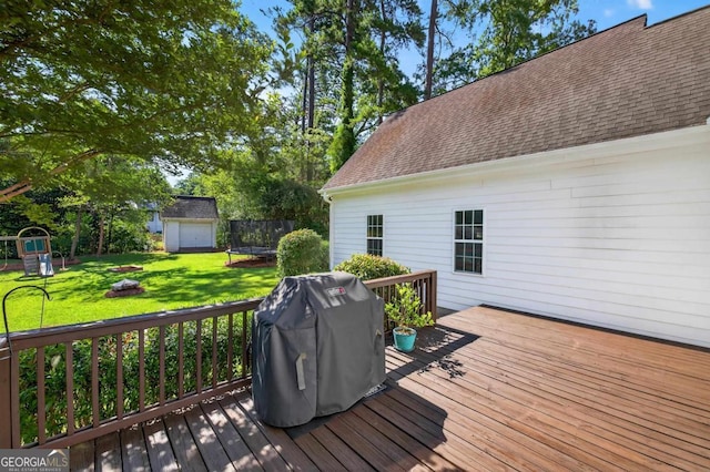 103 W Second St, Greensboro, GA 30642 - deck with a yard, a grill, a playground, an outdoor fire pit, and an outdoor structure
