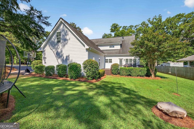 103 W Second St, Greensboro, GA 30642 - rear view of property with a trampoline