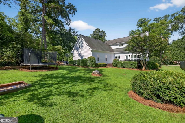 103 W Second St, Greensboro, GA 30642 - view of grassy yard with a trampoline
