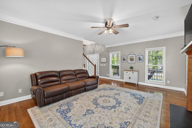 103 W Second St, Greensboro, GA 30642 - living room featuring ceiling fan, crown molding, wood finished floors, and stairway