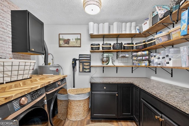 1724 Cedar Grove Church Rd, Winder, GA 30680 - kitchen featuring open shelves, light wood-style flooring, independent washer and dryer, dark cabinets, and a textured ceiling