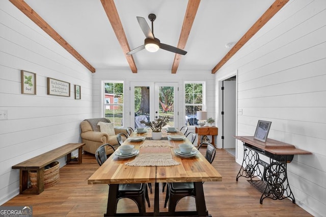 1724 Cedar Grove Church Rd, Winder, GA 30680 - dining room with a ceiling fan, wood walls, and wood finished floors