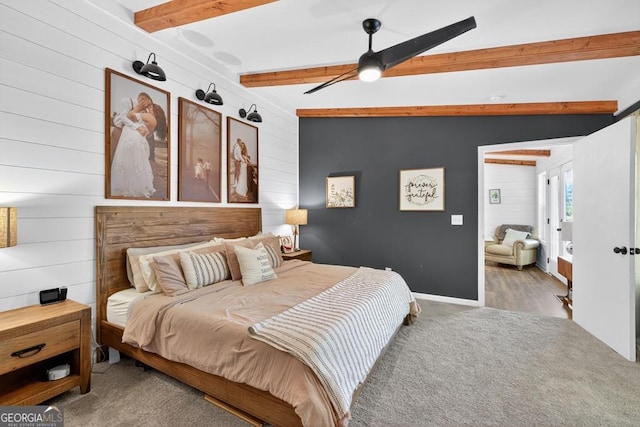1724 Cedar Grove Church Rd, Winder, GA 30680 - bedroom featuring beamed ceiling, wooden walls, carpet floors, and a ceiling fan