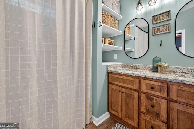 1724 Cedar Grove Church Rd, Winder, GA 30680 - bathroom with double vanity and wood finished floors
