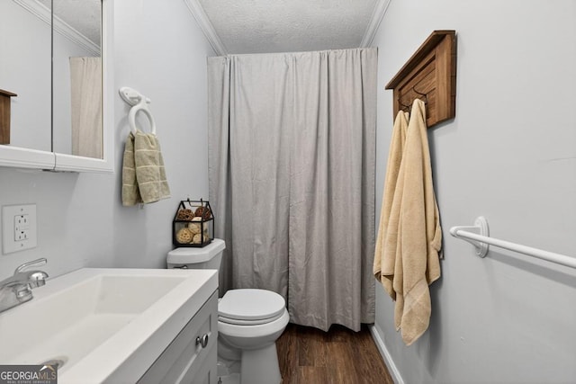 1724 Cedar Grove Church Rd, Winder, GA 30680 - bathroom with ornamental molding, a textured ceiling, wood finished floors, and vanity
