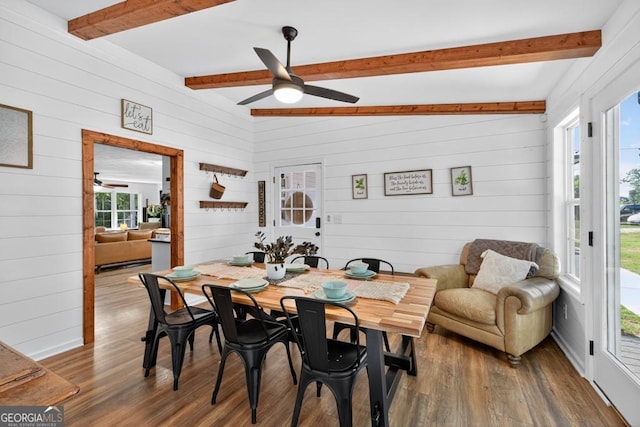 1724 Cedar Grove Church Rd, Winder, GA 30680 - dining space with ceiling fan, beamed ceiling, wood walls, healthy amount of natural light, and wood finished floors